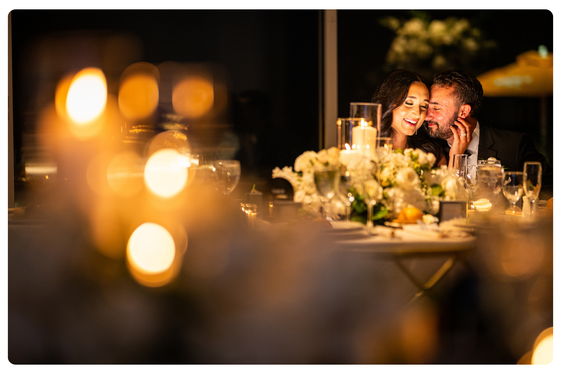 bride and groom sharing moment at dinner