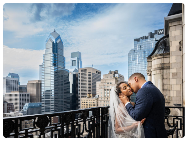 bride and groom on a balcony in new york
