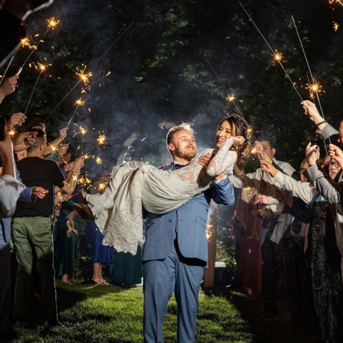 groom carrying bride after getting married